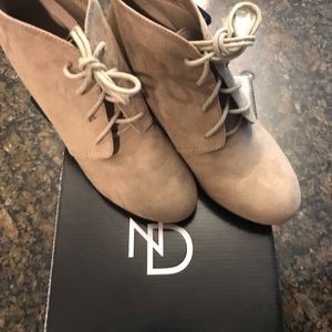 Tan, suede lace-up ankle boot.